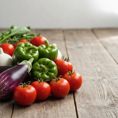 A vibrant assortment of fresh, colorful vegetables artfully arranged on a rustic wooden table, with soft, natural lighting, no text, no words, no typography, no labels, clean image