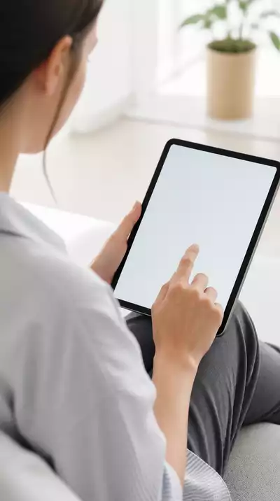 User submitting online form on tablet