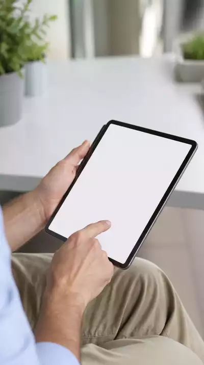 User submitting online form on tablet
