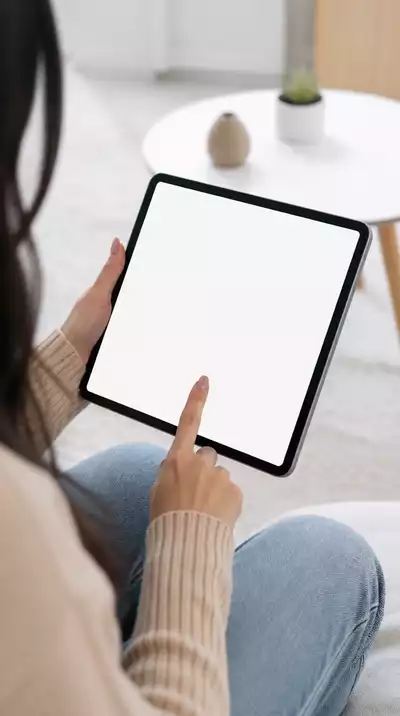 User submitting online form on tablet