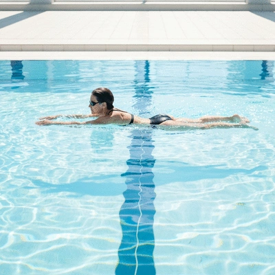 User swimming in a pool